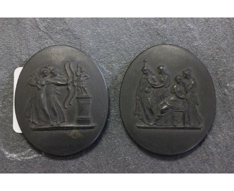 Two 19th century Wedgwood black ceramic oval plaques, stamped Wedgwood to the reverse 
