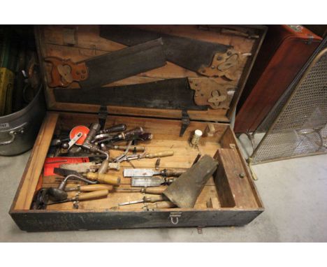 Wooden tool box trunk containing vintage tools