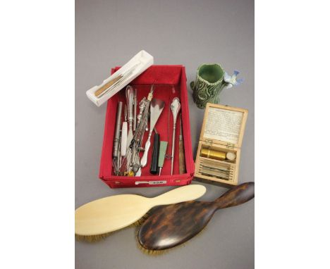 A silver button hook and other items 