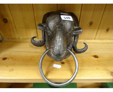 Metal door knocker in the form of a Ram's head