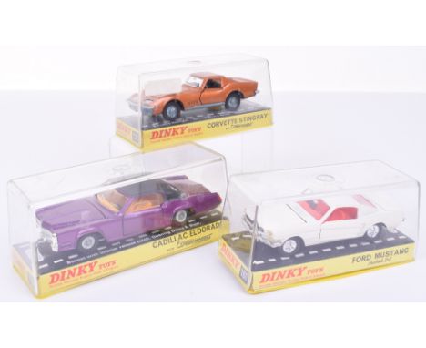 Dinky three American cars, 161 Ford Mustang fastback 2x2 white, red interior, cast-in logo, cast hubs, 175 Cadillac Eldorado,