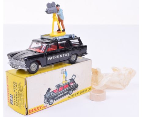 Dinky 281 Pathe News Camera car, black body, red interior, cast wheels, cameraman with brown trousers, mint condition, in yel