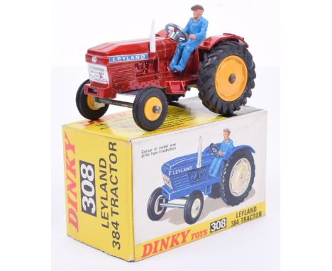 Dinky 308 Leyland 384 tractor, metallic red body, blue plastic driver, yellow hubs, ‘LEYLAND’ stickers, white exhaust, mint c