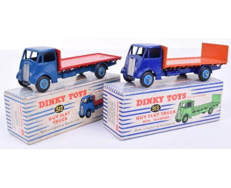 Dinky Supertoys two Guy trucks. 512 Guy flat truck, dark blue cab and chassis, red flatbed and mid-blue grooved hubs, excelle