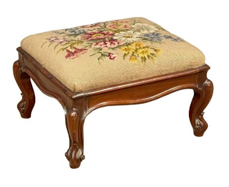A small Victorian mahogany footstool on cabriole legs and tapestry top. 40x35x27cm. 