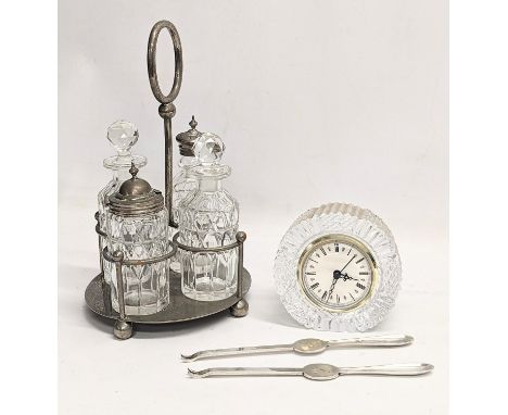 A sundry lot. Including a Tyrone Crystal mantle clock, a vintage cruet set and a pair of silver plated lobster forks 