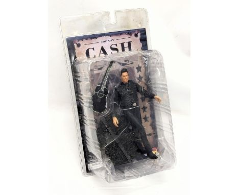 An unopened Johnny Cash (1932-2003) Walk The Line, Man In Black Action Figure Toy by Sota Toys. 