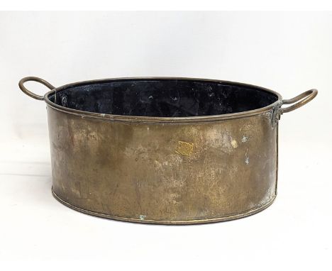 An early 20th century brass planter. 41x15cm 