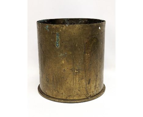 A large brass World War I Trench Art canon shell, dated September 1917. 22x23cm 