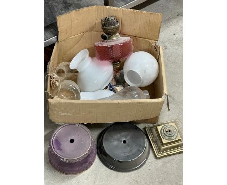 A box of oil lamp shades and parts etc. 