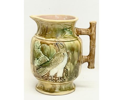 A large late 19th century Majolica pitcher. 20.5x22.5cm 