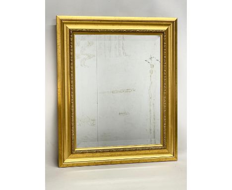 A gilt framed bevelled mirror. 55x65.5cm. 