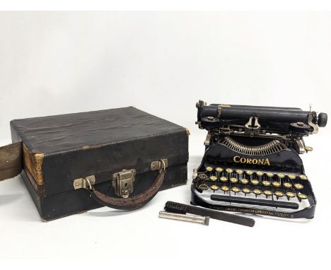 An early 20th century miniature Corona typewriter, dated 1917. 