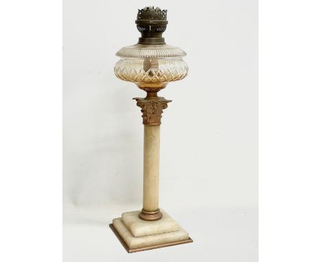 A large Victorian onyx and brass oil lamp with Corinthian style pillar. 56cm 