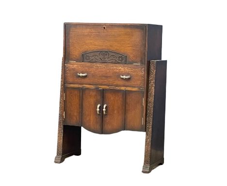 A 1930’s Art Deco oak bureau.  76x36x108cm 