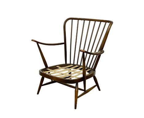 An Ercol Mid Century Elm armchair. Model 477. 