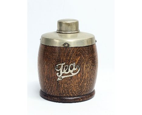 An early 20th century oak and silver plated tea caddy. 14.5cm 