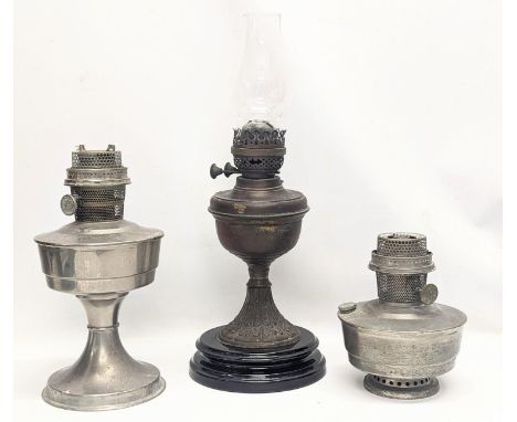 A Victorian oil lamp with glass funnel, with 2 other Aladdin lamps. Victorian lamp measures 48cm 