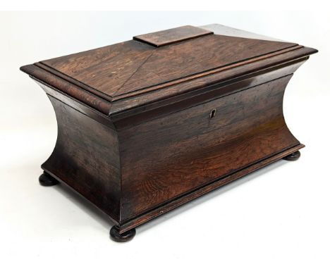 A large Regency rosewood tea caddy in sarcophagus shape, circa 1810. 37x21.5x22.5cm 