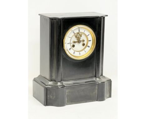 A Victorian slate mantle clock with key and pendulum. 28x17x32.5cm 