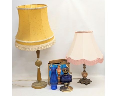 A vintage oil lamp in box, with 2 table lamps. Tallest measures 80cm 