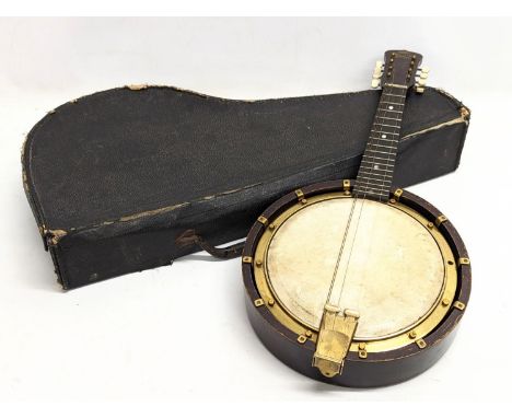 An early 20th century banjolele by Bell-Tone in case. 