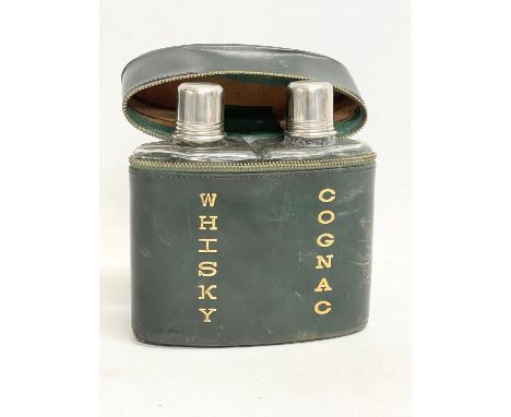 A vintage leather whisky and cognac decanter flask. 13x15cm 