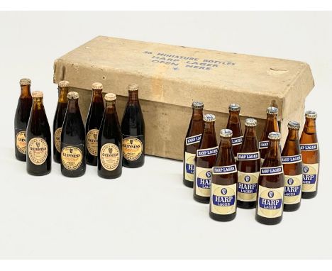 A collection of vintage miniature Guinness and Harp unopened bottles. 