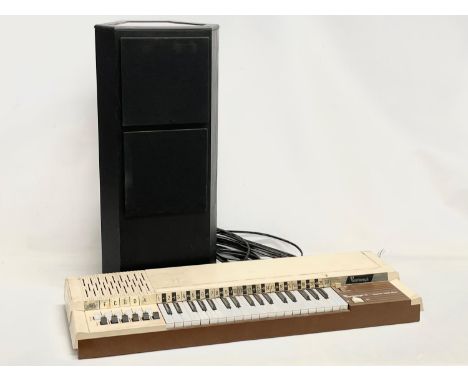 A vintage Bontempi Electric Chord Organ and a Tannoy speaker. 