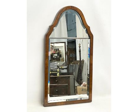 A 1920’s mahogany framed mirror. 39x71cm 