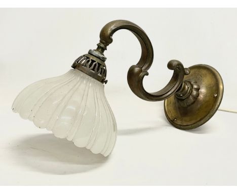 A vintage brass wall lighting fitting with glass shade. 36cm 
