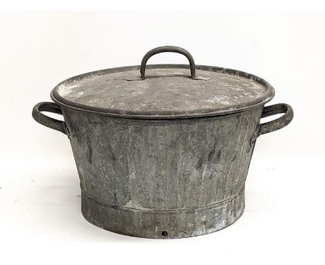 A vintage galvanized two handled basin with lid. 49x34cm 
