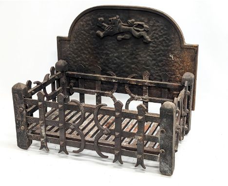 A vintage cast iron dog grate. 52x34x43cm 