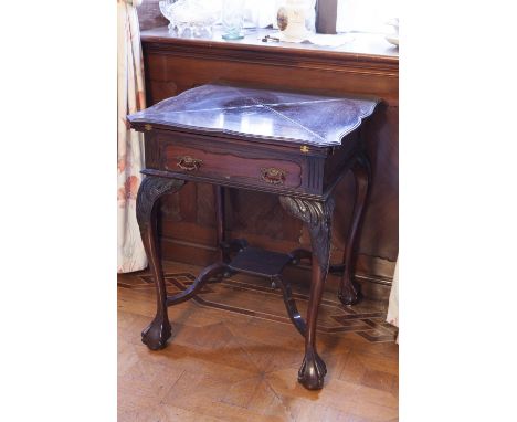 A CARVED MAHOGANY CARD TABLE WITH ENVELOPE FOLDING TOP, ONE DRAWER, ON CABRIOLE LEGS WITH CLAW AND BALL FEET