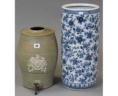 A stoneware spirit dispenser fitted with a tap, 34cm high; &amp; a modern Chinese-style blue &amp; white floral decorated sti