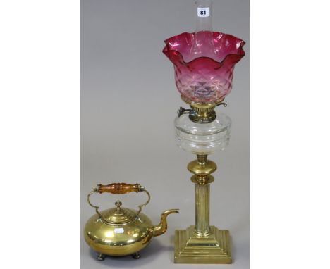 An Edwardian brass oil table lamp with fluted centre column, on a square stepped base, with a clear glass reservoir, &amp; ha