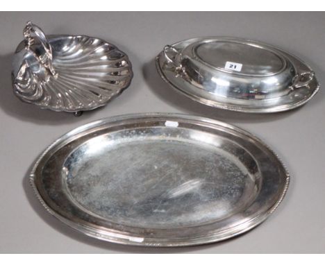 A silver-plated oval serving platter 47 x 34cm; another, 44.5 x 31cm; a plated oval entrée dish; &amp; a scallop-shell servin