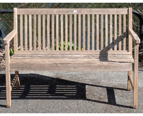 A teak slatted garden bench on four square legs with plain stretchers, 121cm wide - retailed by John Lewis (loose in the join
