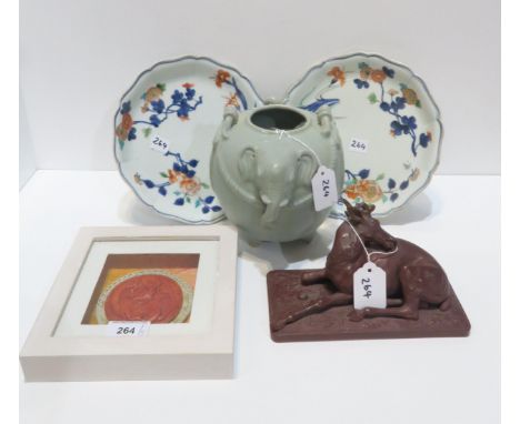 A Elephant head celadon glazed pot, a model of a stag, two Chines plates and a framed plaque Condition Report:Available upon 