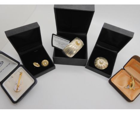 A silver Paula Bolton bangle and brooch with matching earrings all set with pearls, and two costume jewellery brooches Condit