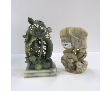 A Chinese white hardstone model of lotus flowers and ducks together with a green hardstone group carved with fish, shells and