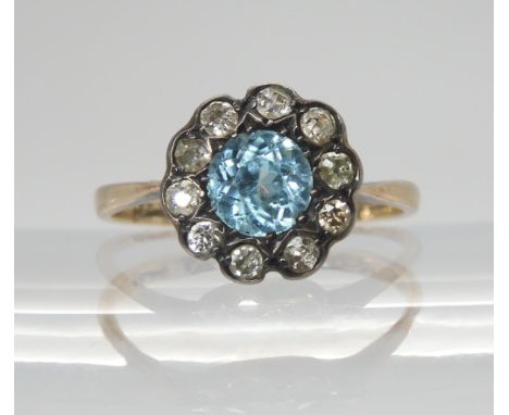 An 18ct gold blue zircon and diamond cluster ring, size O1/2, inscribed to inner shank and dated 1937, weight 2.1gms, in vint