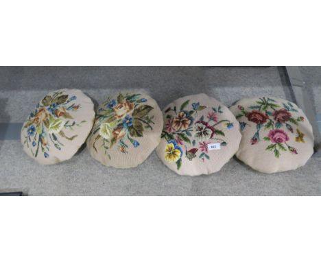 Four round tapestry covered cushions Condition Report:Not available for this lot.