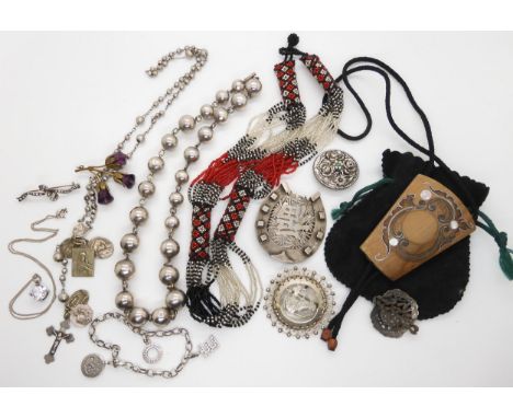 A Chinese white metal horseshoe buckle, other items of silver and white metal to include a German silver retro brooch by K &a