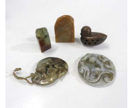 A Chinese hardstone pendant carved with fighting tigers, a disc pendant, a wooden netsuke of a bird and two hardstone seals C