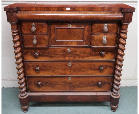 A Victorian mahogany Scotch chest of drawers with barley twist columns flanking central bank of drawers, 133cm high x 128cm w