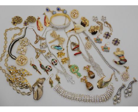 A dragonfly brooch by Attwood &amp; Sawyer, a Swarovski bangle, and earrings, a marine style chain by Adrien Mann etc Conditi