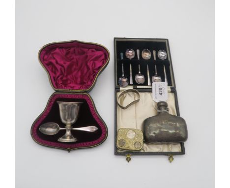 A silver flask by William Henry Sparrow, Birmingham 1902, a silver napkin ring, a cased silver christening set, by Fenton, Ru