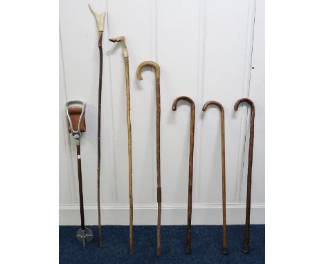 A lot of six assorted walking sticks and a shooting stick (7) Condition Report:Available upon request