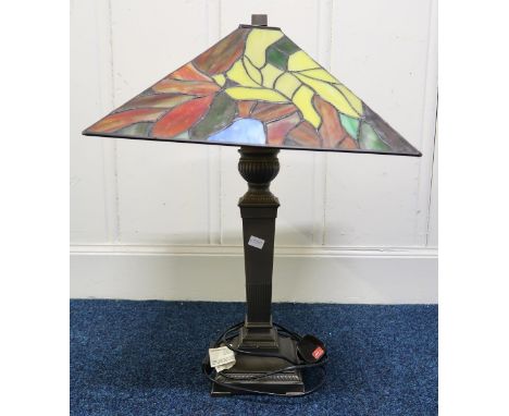 A 20th century brass base table lamp with Tiffany style shade Condition Report:Available upon request